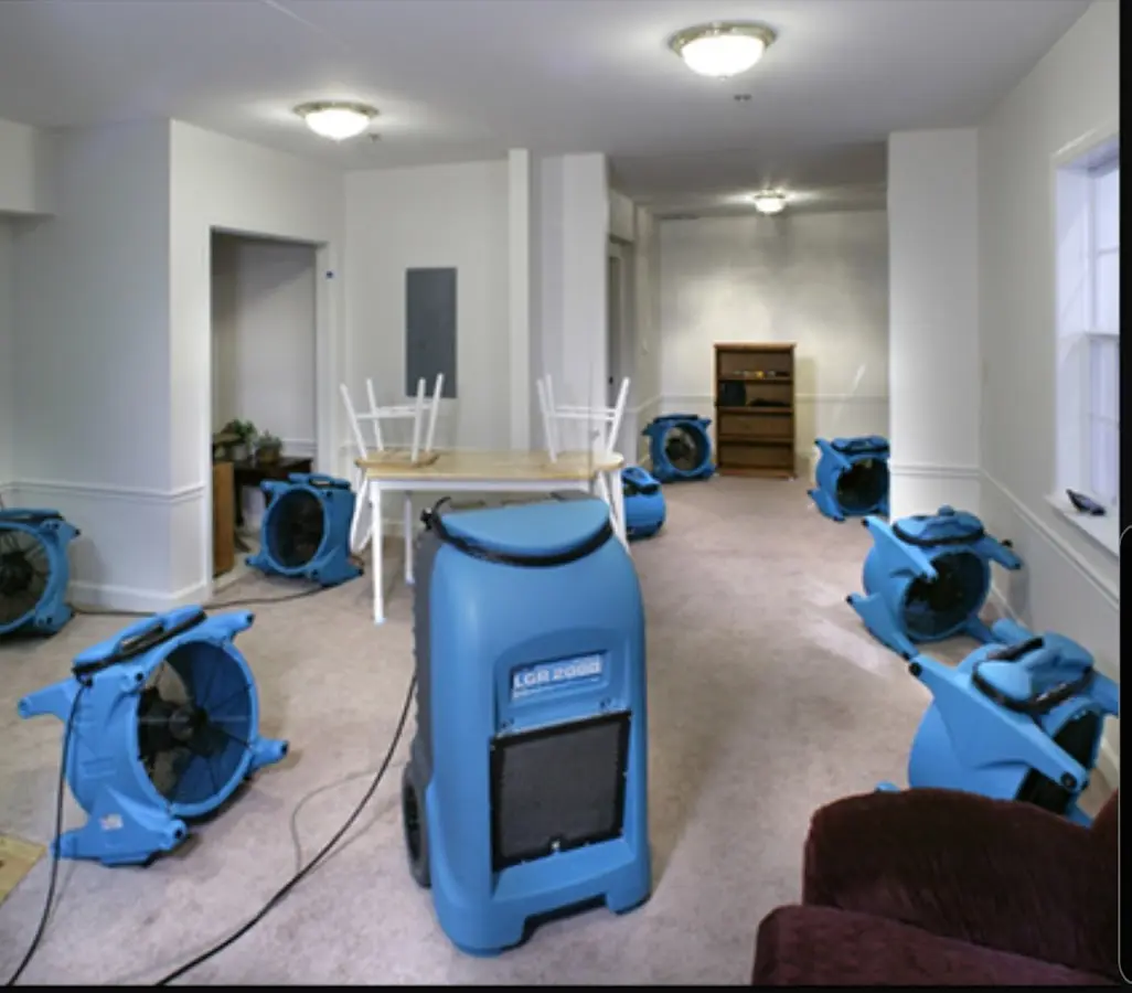 Air movers and dehumidifier setup for Water Damage Restoration in Corning